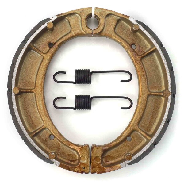 Brake shoes with springs grooved